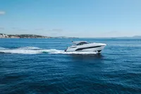 2020 Fairline Targa 45 Open yacht cruising on open sea under clear blue sky.