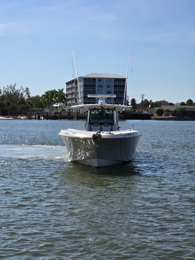  Yacht Photos Pics HCB 42 Siesta 2017 boat on calm water near coastal building.