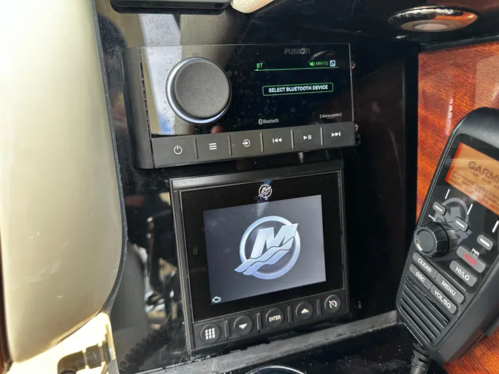  Yacht Photos Pics Control panel of 2023 Chris-Craft Launch 31 GT with audio and navigation systems.