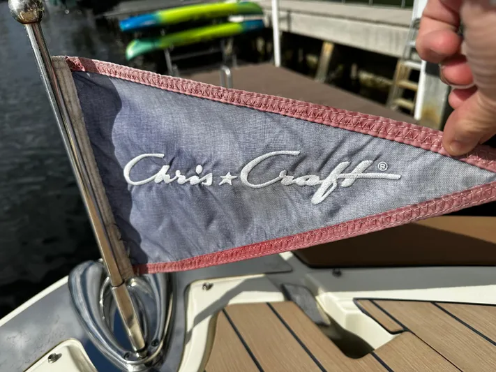  Yacht Photos Pics Chris-Craft Launch 31 GT 2023 flag on boat deck, close-up view.