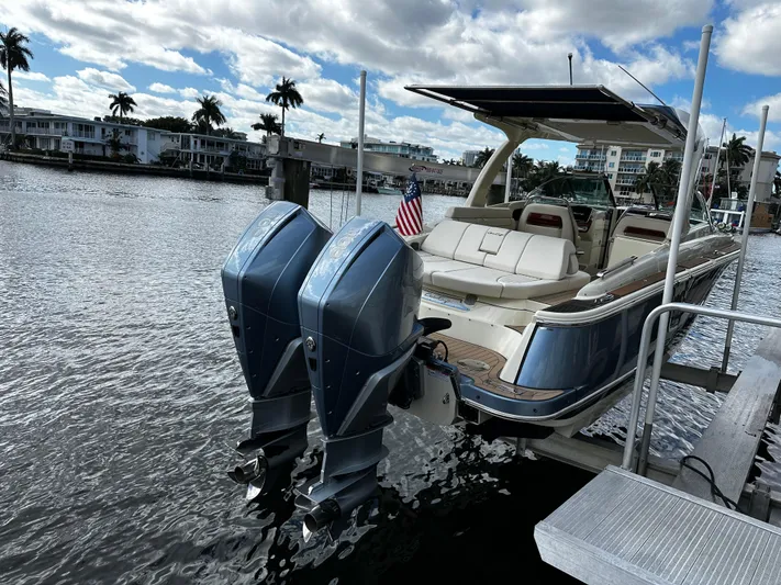  Yacht Photos Pics 2023 Chris-Craft Launch 31 GT boat docked with twin engines, scenic waterfront view.