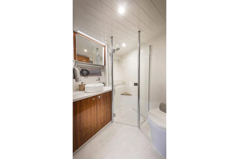  Yacht Photos Pics Manufacturer Provided Image: Luxurious bathroom in 2021 Riviera 64 Sports Motor Yacht with modern fixtures.