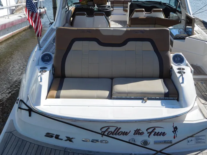  Yacht Photos Pics 2015 Sea Ray 350 SLX boat with "Follow the Fun" decal, docked with American flag.