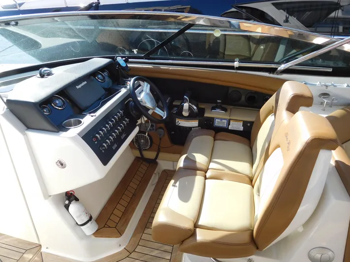  Yacht Photos Pics 2015 Sea Ray 350 SLX boat interior with tan leather seats and modern dashboard.