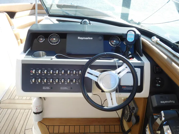  Yacht Photos Pics 2015 Sea Ray 350 SLX helm with steering wheel and control panel.