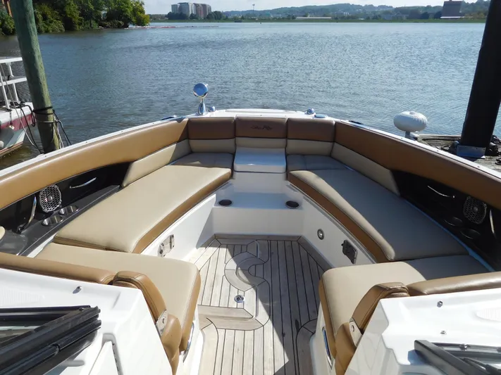  Yacht Photos Pics 2015 Sea Ray 350 SLX boat with spacious seating on a serene lake.