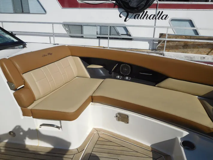  Yacht Photos Pics Luxurious seating on 2015 Sea Ray 350 SLX boat, featuring tan upholstery and sleek design.