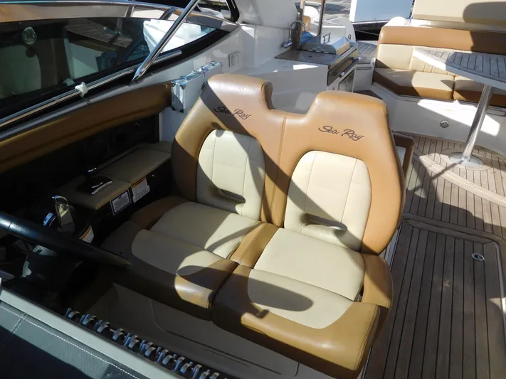  Yacht Photos Pics 2015 Sea Ray 350 SLX boat interior with tan leather seats and wooden flooring.