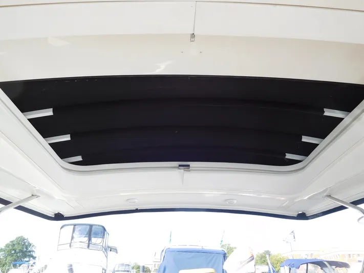  Yacht Photos Pics 2015 Sea Ray 350 SLX boat canopy with open sky view.