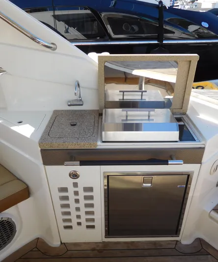  Yacht Photos Pics 2015 Sea Ray 350 SLX yacht kitchenette with sink, grill, and mini fridge.