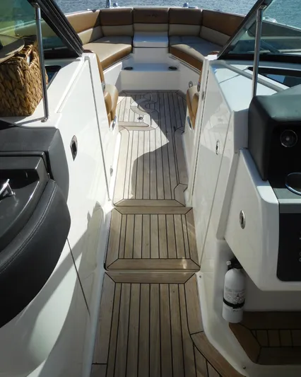  Yacht Photos Pics 2015 Sea Ray 350 SLX boat interior with teak flooring and cushioned seating.