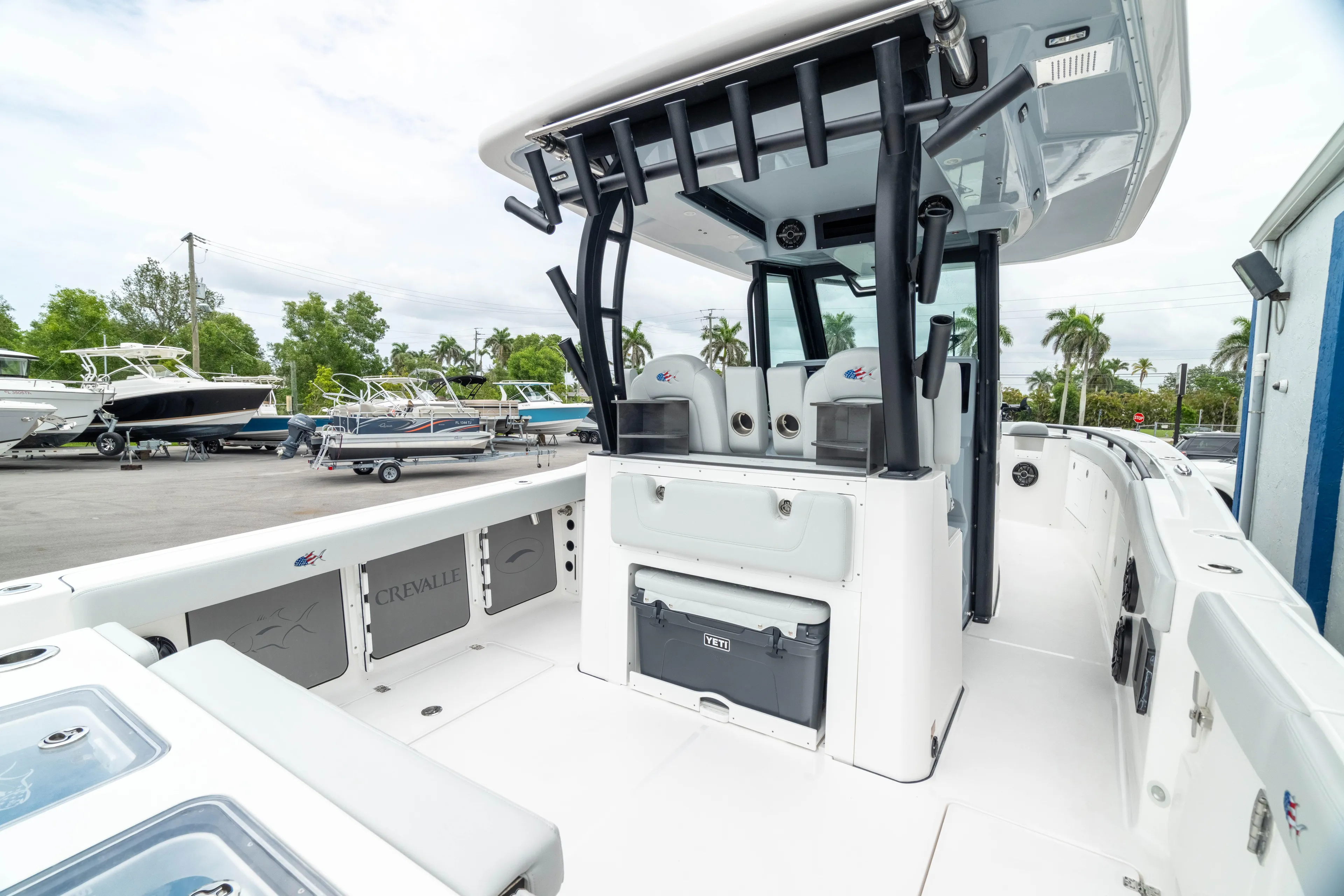  Yacht Photos Pics 2026 Crevalle 33 CSF boat interior with seating and storage, docked outdoors.