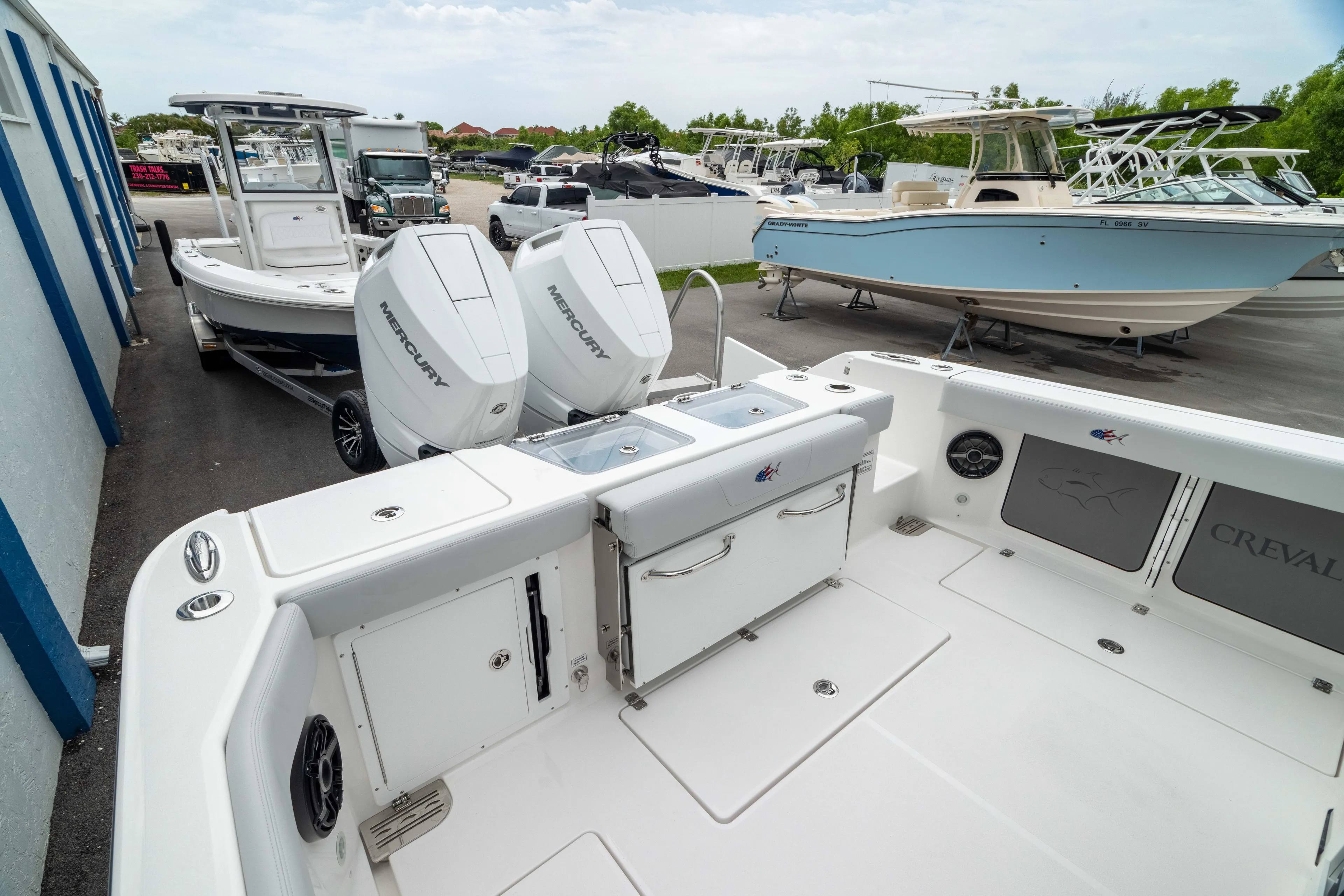  Yacht Photos Pics 2026 Crevalle 33 CSF boat with dual Mercury outboard engines, docked at a marina.