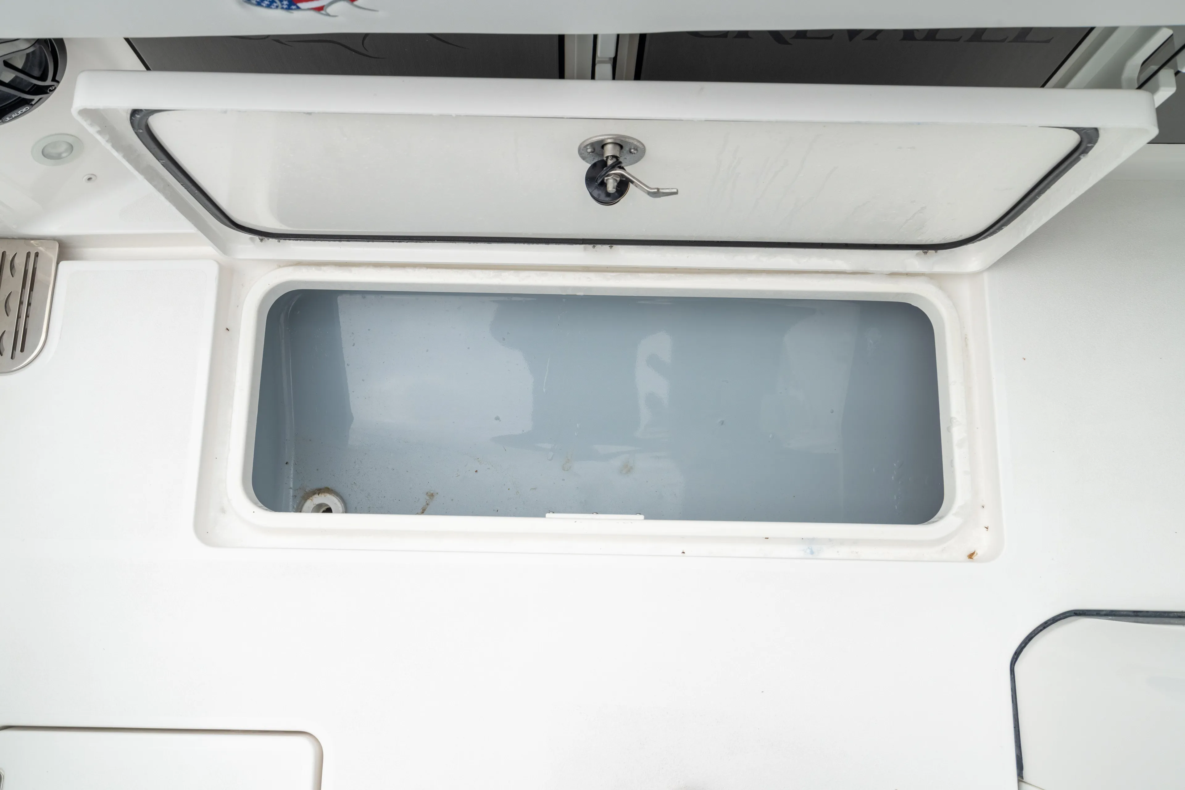  Yacht Photos Pics Livewell compartment on 2026 Crevalle 33 CSF boat, featuring a secure latch.