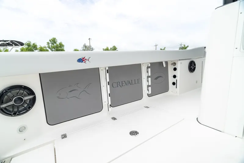  Yacht Photos Pics 2026 Crevalle 33 CSF boat interior with storage compartments and speaker.