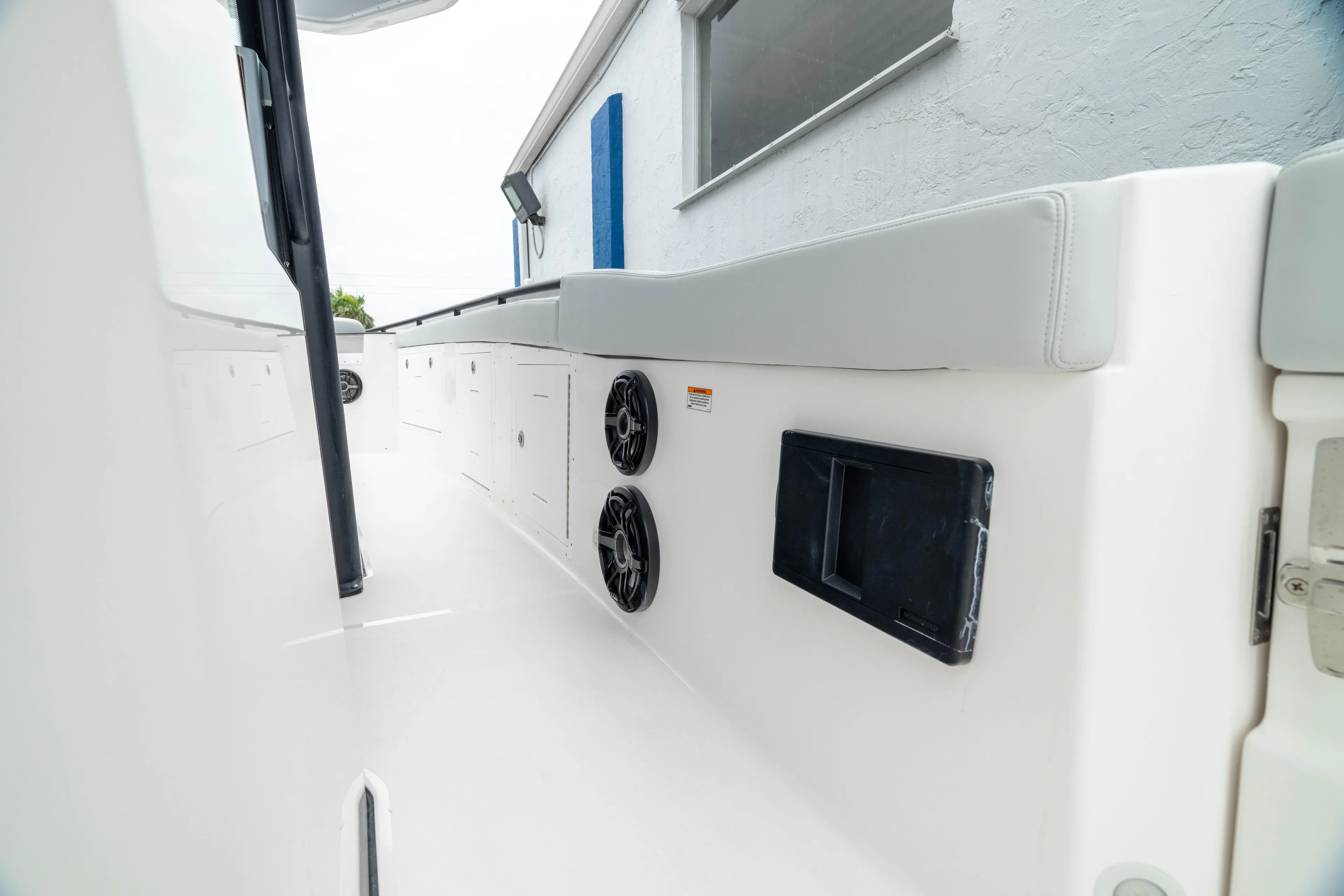  Yacht Photos Pics 2026 Crevalle 33 CSF boat interior with speakers and storage compartments.