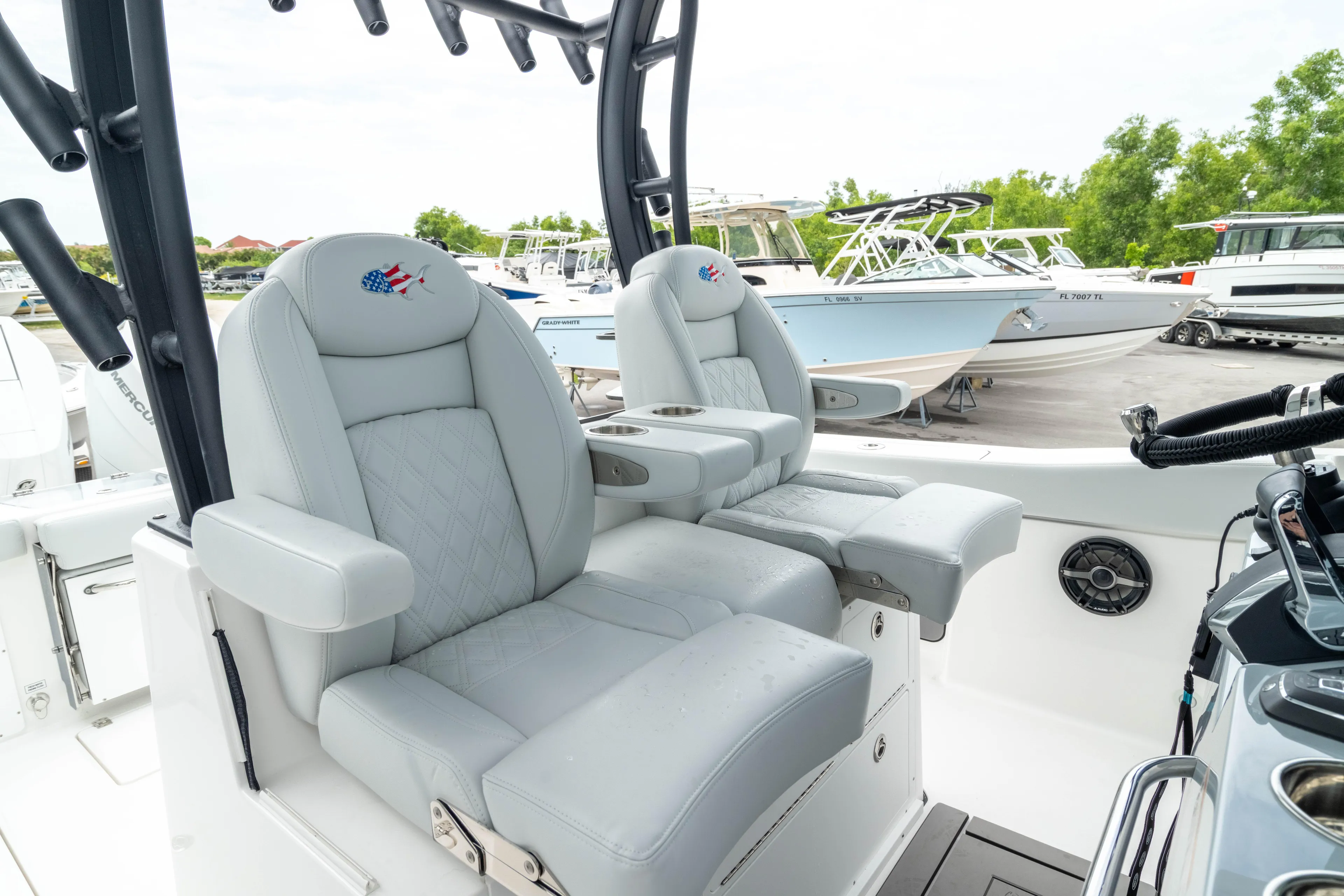  Yacht Photos Pics Luxury seating on 2026 Crevalle 33 CSF boat, featuring plush captain's chairs and modern design.