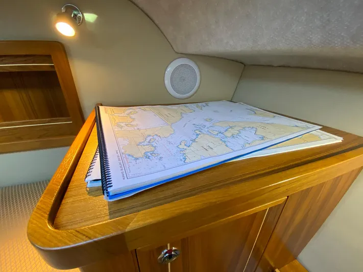  Yacht Photos Pics Nautical map on wooden table in 2019 Aspen C107 cabin interior.