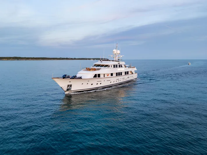 Sweet Escape Yacht Photos Pics Luxury 1993 Christensen Semi Displacement yacht cruising on calm blue waters.