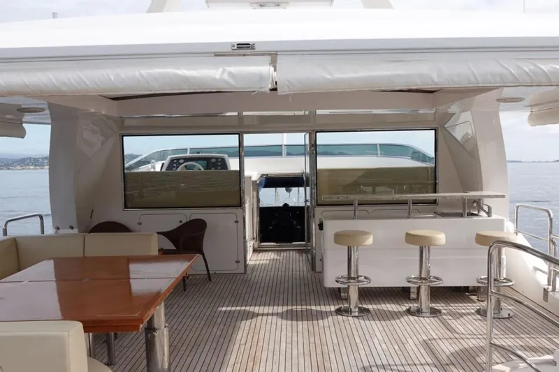 Sea Bear Yacht Photos Pics Luxurious 2013 Benetti Delfino 93 yacht deck with seating and bar area.