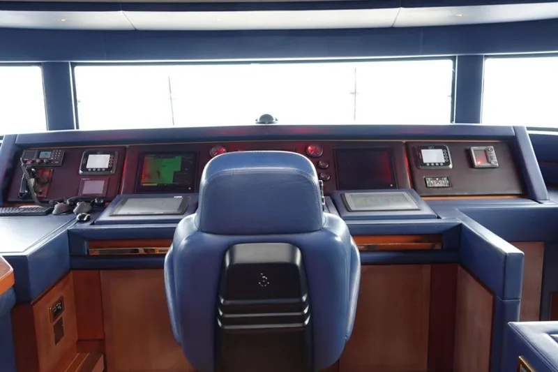 Sea Bear Yacht Photos Pics Bridge of 2013 Benetti Delfino 93 yacht with navigation equipment and captain's chair.