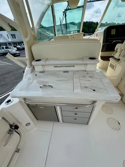  Yacht Photos Pics 2025 Grady-White 345 boat interior with storage and seating area.