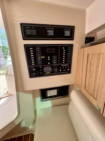  Yacht Photos Pics Control panel inside 2025 Grady-White 345 boat, featuring modern navigation and system controls.