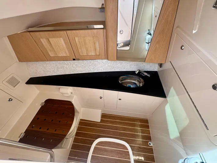 Yacht Photos Pics Luxurious 2025 Grady-White 345 boat interior with modern wood finishes and sleek design.