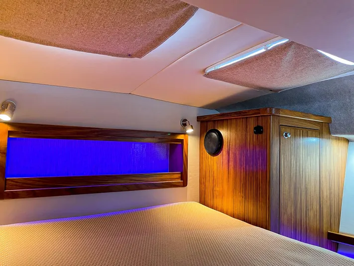 Sojourn Yacht Photos Pics 2022 Aspen C108 interior with wood accents, ambient lighting, and modern design.