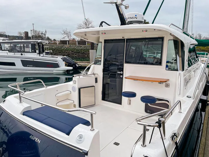 Sojourn Yacht Photos Pics 2022 Aspen C108 boat docked, featuring spacious deck and modern amenities.