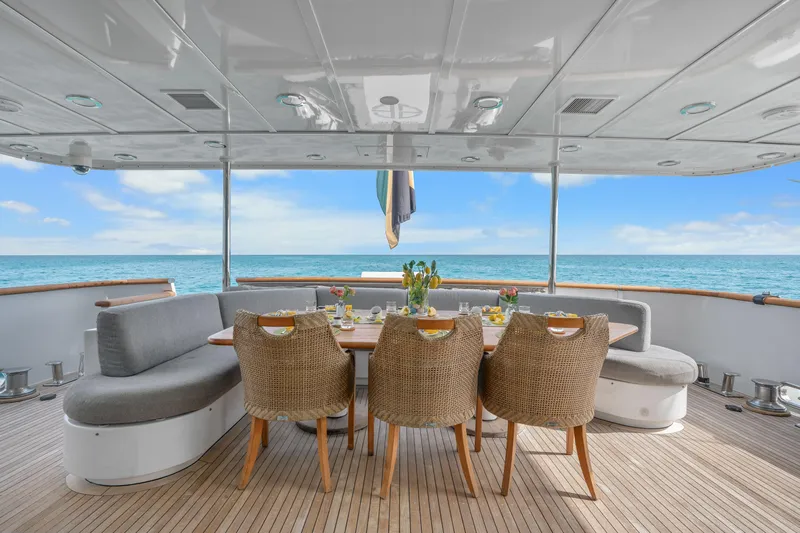 Sweet Escape Yacht Photos Pics Outdoor dining area on a 1993 Christensen Semi Displacement yacht with ocean view.