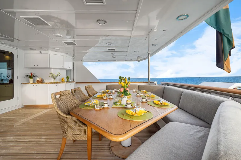 Sweet Escape Yacht Photos Pics Luxurious dining area on 1993 Christensen Semi Displacement yacht with ocean view.