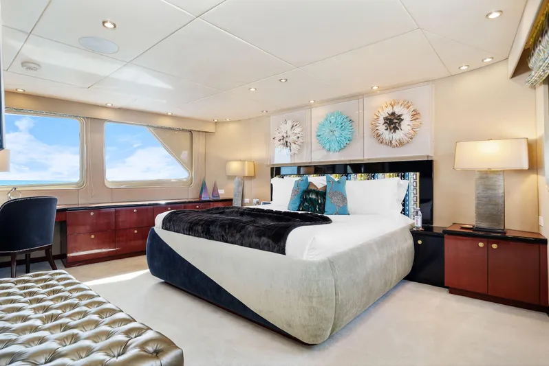 Sweet Escape Yacht Photos Pics Luxurious bedroom interior of 1993 Christensen Semi Displacement yacht with modern decor and ocean view.