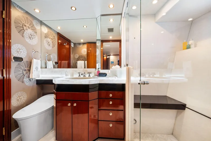 Sweet Escape Yacht Photos Pics Luxurious bathroom in a 1993 Christensen Semi Displacement yacht with modern fixtures and elegant design.