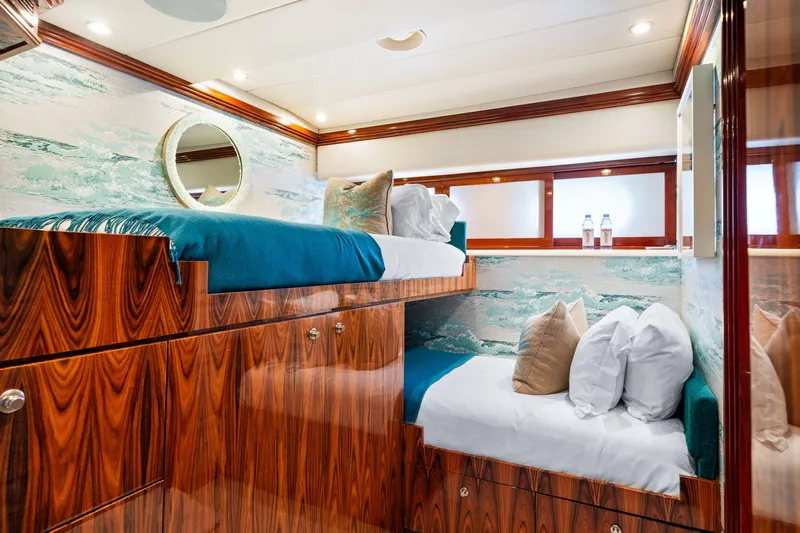 Sweet Escape Yacht Photos Pics Luxurious cabin interior of 1993 Christensen Semi Displacement yacht with wooden bunk beds.