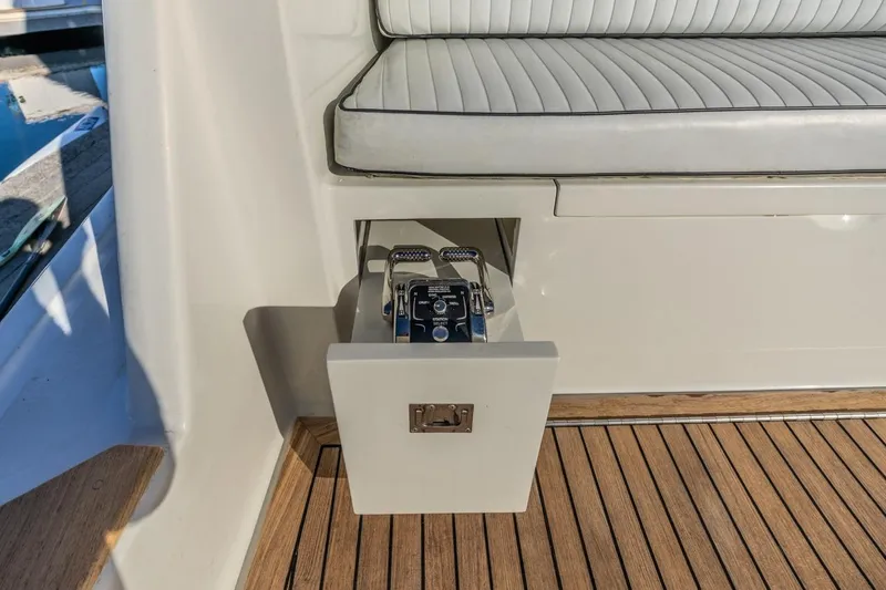 Kolohe Yacht Photos Pics Control panel on 1993 Ocean 65 Custom yacht with teak flooring and cushioned seating.