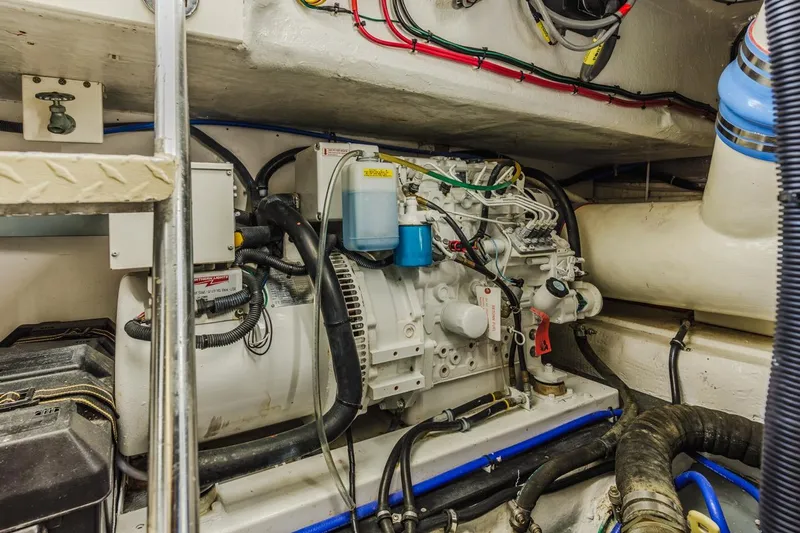 Kolohe Yacht Photos Pics Engine room of 1993 Ocean 65 Custom yacht with visible machinery and wiring.