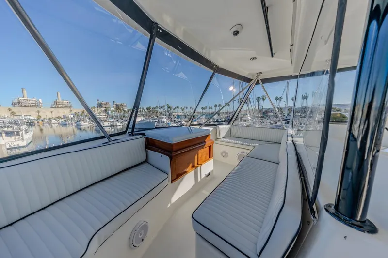 Kolohe Yacht Photos Pics Interior view of 1993 Ocean 65 Custom yacht with marina backdrop.