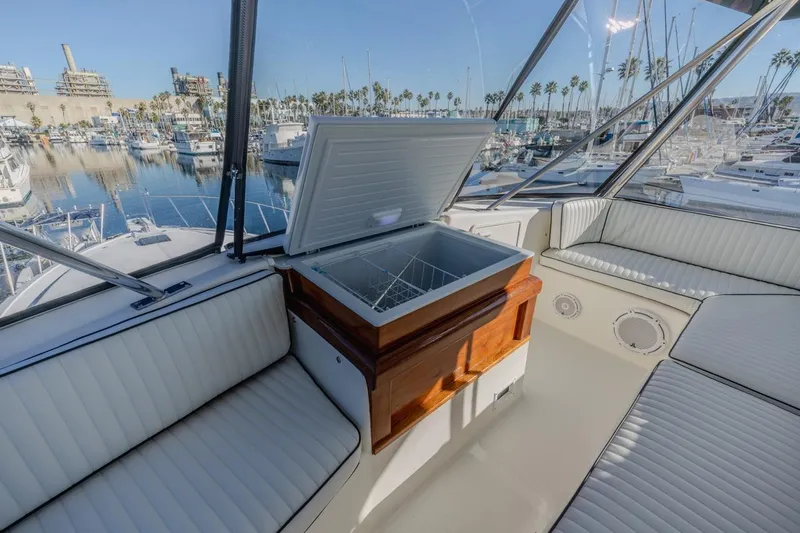 Kolohe Yacht Photos Pics Luxurious 1993 Ocean 65 Custom yacht interior with open cooler and marina view.