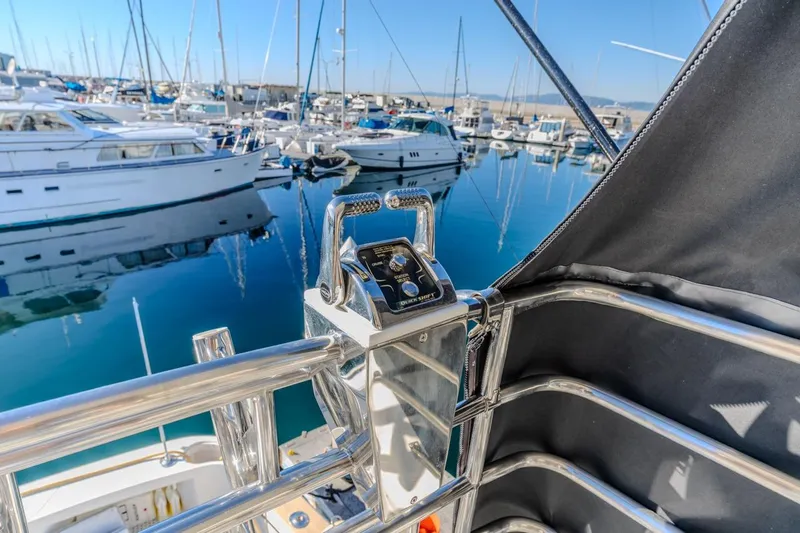Kolohe Yacht Photos Pics Control panel on a 1993 Ocean 65 Custom yacht in a marina setting.
