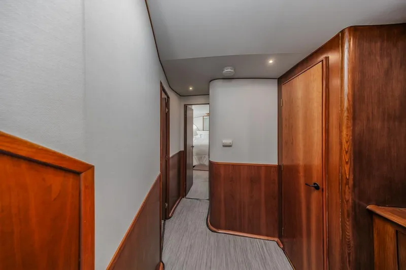 Kolohe Yacht Photos Pics Hallway of 1993 Ocean 65 Custom yacht with wooden paneling and modern design.