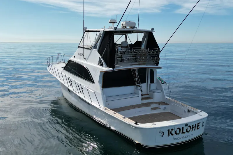 Kolohe Yacht Photos Pics 1993 Ocean 65 Custom yacht on calm sea, featuring spacious deck and sleek design.