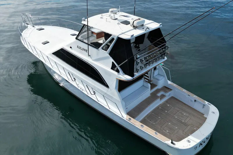 Kolohe Yacht Photos Pics 1993 Ocean 65 Custom yacht on calm water, featuring spacious deck and sleek design.