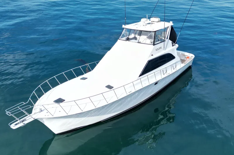 Kolohe Yacht Photos Pics White 1993 Ocean 65 Custom yacht on calm blue water.