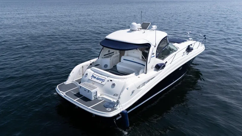  Yacht Photos Pics 2005 Sea Ray 420 Sundancer yacht on calm water, rear view.