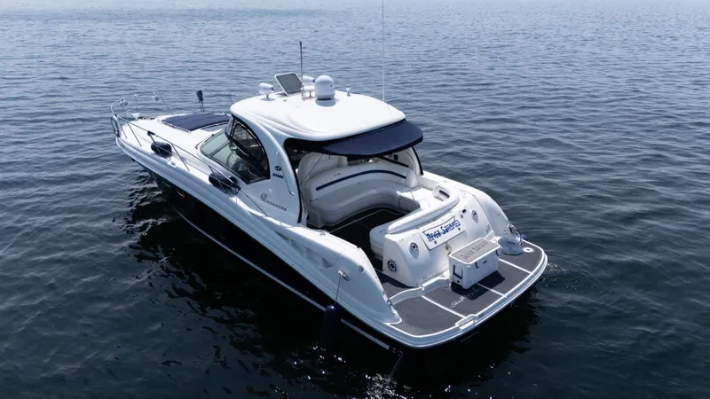  Yacht Photos Pics 2005 Sea Ray 420 Sundancer yacht on calm water, rear view.