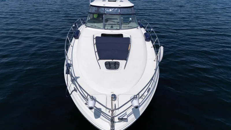  Yacht Photos Pics 2005 Sea Ray 420 Sundancer yacht on calm water, aerial view.