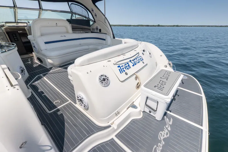  Yacht Photos Pics 2005 Sea Ray 420 Sundancer yacht with spacious deck and seating on calm water.