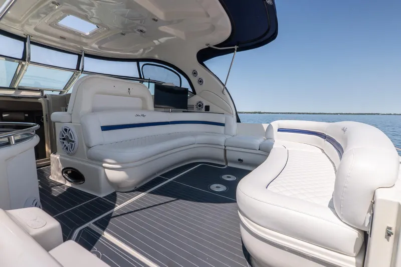  Yacht Photos Pics 2005 Sea Ray 420 Sundancer yacht interior with white seating and open water view.
