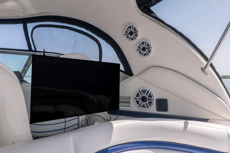  Yacht Photos Pics 2005 Sea Ray 420 Sundancer interior with TV and speakers, showcasing luxury boat features.